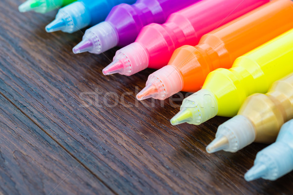 Bottles with colorful dry pigments on wooden background Stock photo © bubutu