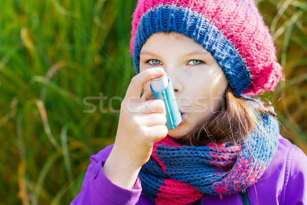 Girl Using Inhaler on a autumn day Stock photo © bubutu