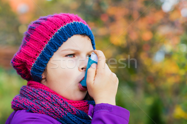 Girl Using Inhaler on a autumn day Stock photo © bubutu