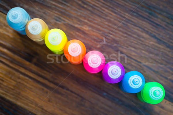 Bottles with colorful dry pigments on wooden background Stock photo © bubutu