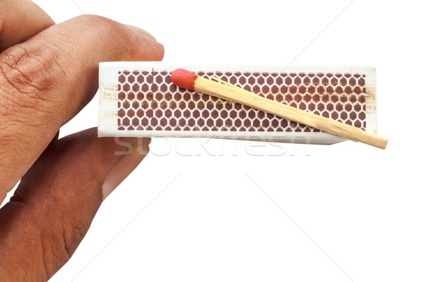 Match on matchbox with hand holding isolate Stock photo © Bunwit