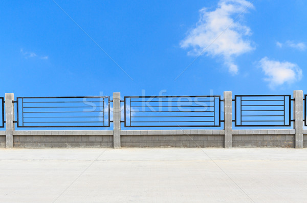 metal fences on cement road with clouds Stock photo © Bunwit