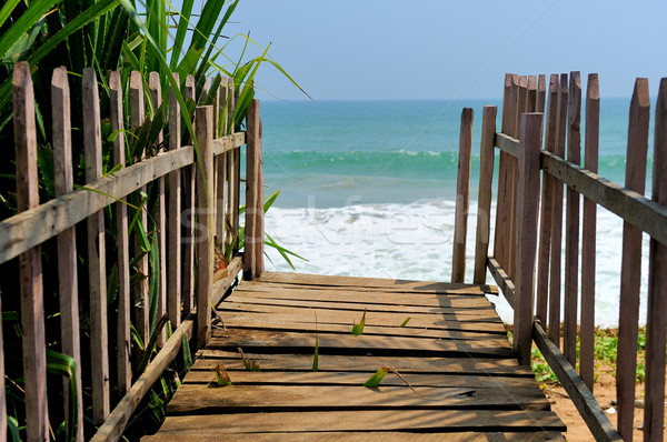 Stock photo: Wooden platform beside tropical beach