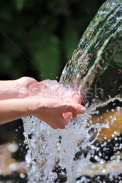 Manos agua mano mujeres cuerpo Foto stock © byrdyak