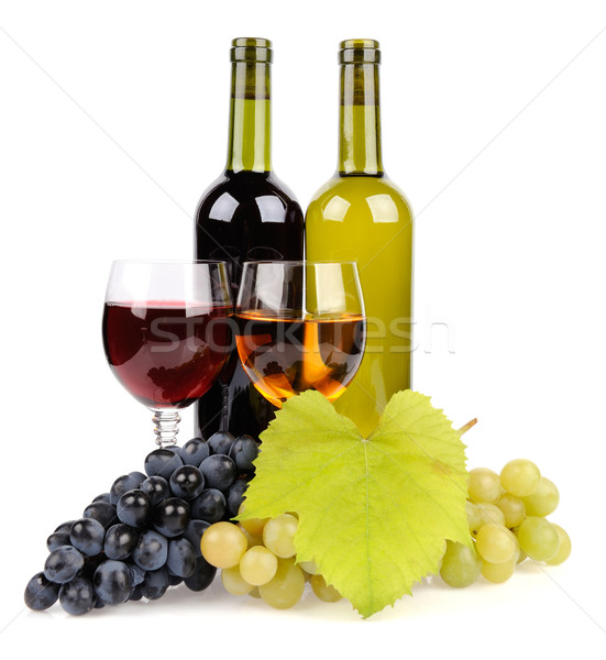 Wine bottle, glass and grapes Stock photo © byrdyak