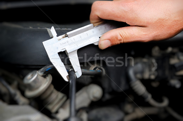 Worker measuring diameter Stock photo © byrdyak
