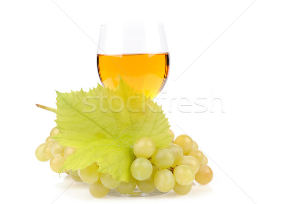 Branch of grapes and glass of wine Stock photo © byrdyak