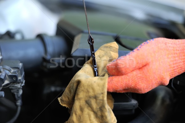 Man inspects the level of oil Stock photo © byrdyak