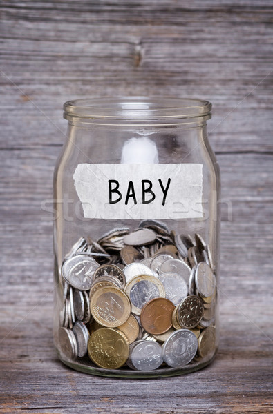 baby, money jar with coins on wood table Stock photo © c12