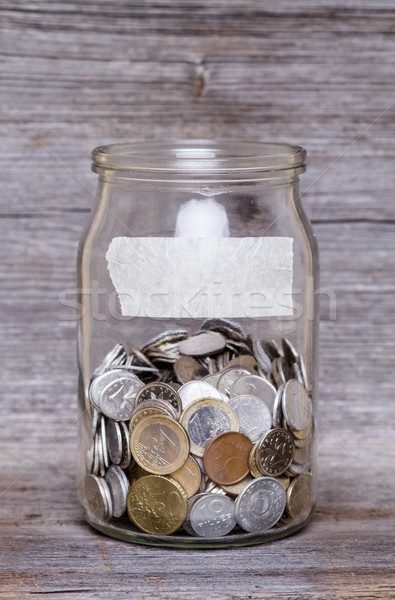money jar with coins on wood table Stock photo © c12