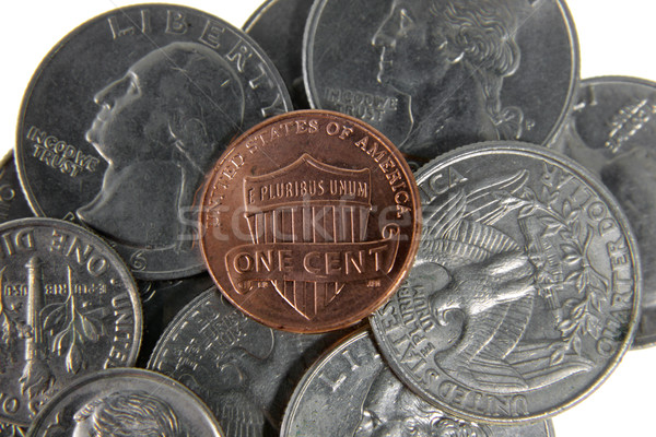 Pens monet posiedzenia inny monety dolarów Zdjęcia stock © ca2hill