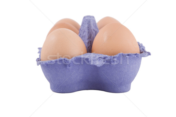 Stock photo: brown hens eggs in blue egg carton