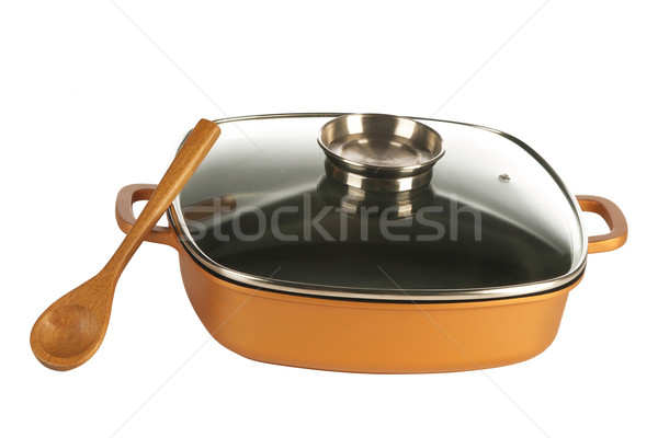 cookware, nonstick pan and wooden spoon Stock photo © caimacanul