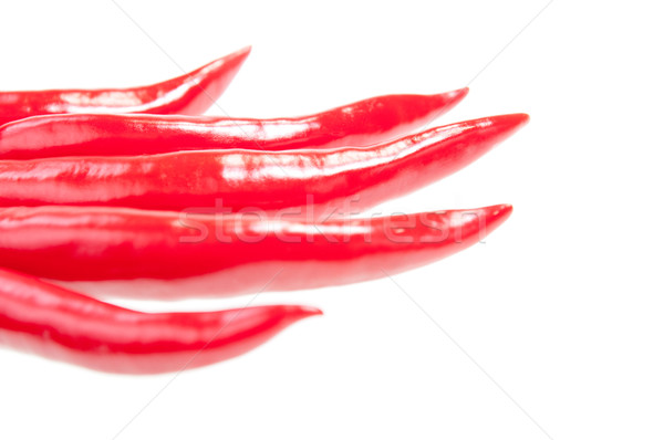 Red chilies set in a shape of five fingers Stock photo © calvste