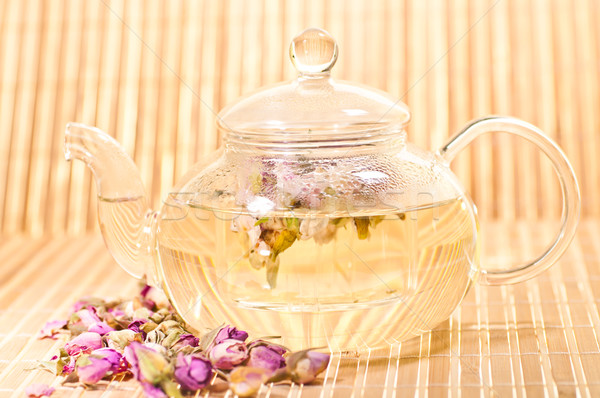 Rózsaszín rózsa tea üveg teáskanna bambusz háttér Stock fotó © calvste