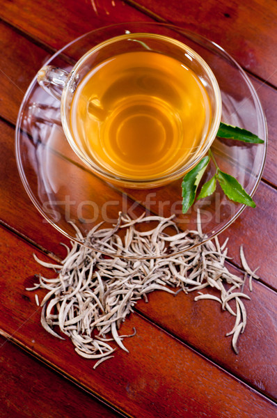 Cup of silver tips tea on a wooden table Stock photo © calvste
