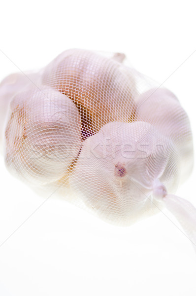 Bulps of garlic in a bag close up Stock photo © calvste