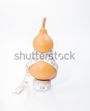 Tape measure around dry bottle gourd in inches Stock photo © calvste