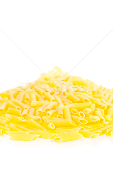 Penne pasta pilled up on a white background Stock photo © calvste