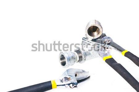Verstellbarer Schraubenschlüssel halten Rohr Wasser Hand Metall Stock foto © calvste