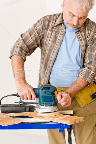 Home improvement - handyman sanding wooden floor Stock photo © CandyboxPhoto