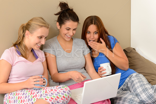 Three young girls watching movie on laptop Stock photo © CandyboxPhoto