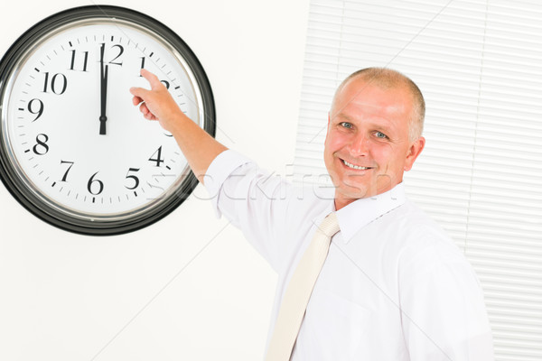 Punctual businessman mature point at clock Stock photo © CandyboxPhoto
