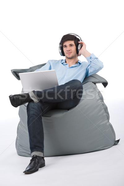Young businessman relax with music and laptop Stock photo © CandyboxPhoto