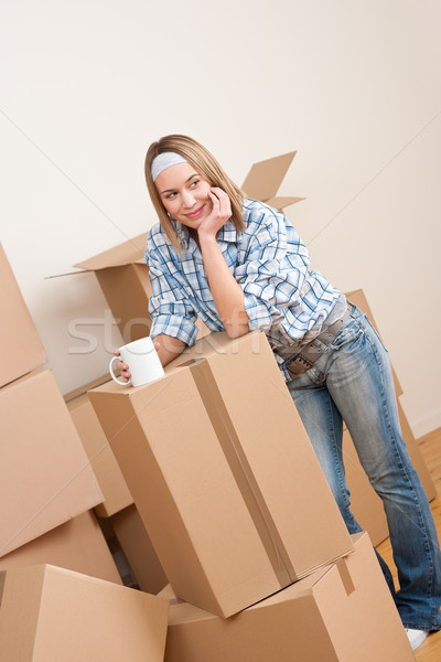 Moving house: Woman with box in new home Stock photo © CandyboxPhoto