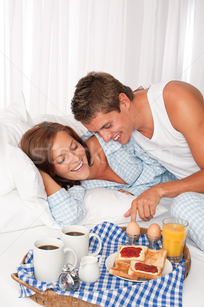 Young man and woman having breakfast together Stock photo © CandyboxPhoto