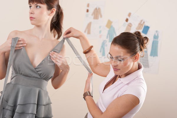 Female fashion designer pinning gray dress on model Stock photo © CandyboxPhoto