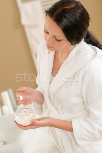 Woman use facial cream in bathroom Stock photo © CandyboxPhoto