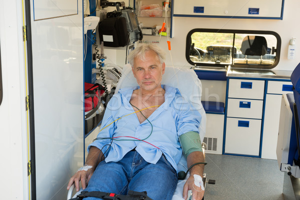 Injured man on stretcher in ambulance car Stock photo © CandyboxPhoto