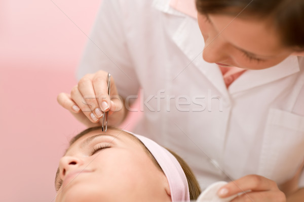 Using tweezers - woman having facial Stock photo © CandyboxPhoto