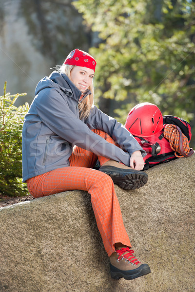 Active woman rock climbing sitting backpack Stock photo © CandyboxPhoto