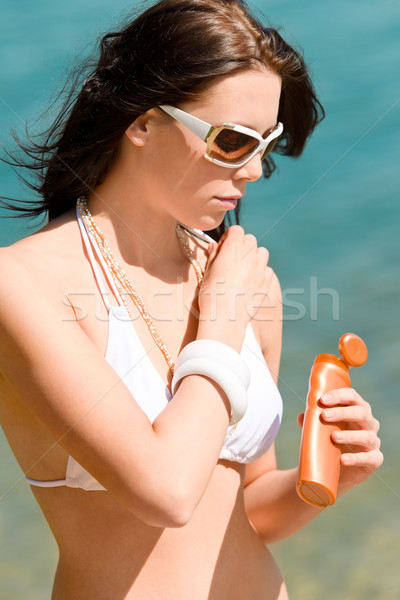 Summer young woman with suncream in bikini Stock photo © CandyboxPhoto