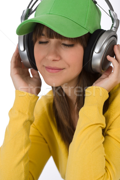 Female teenager enjoy music with headphones Stock photo © CandyboxPhoto