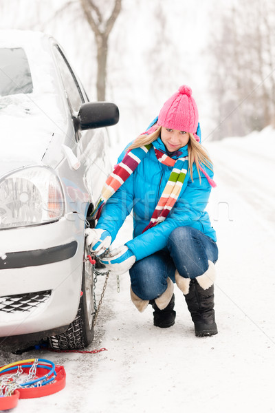 Woman putting winter tire chains car wheel Stock photo © CandyboxPhoto