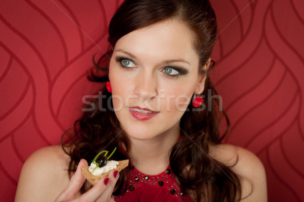 Cocktail party donna mangiare antipasto abito da sera rosso Foto d'archivio © CandyboxPhoto