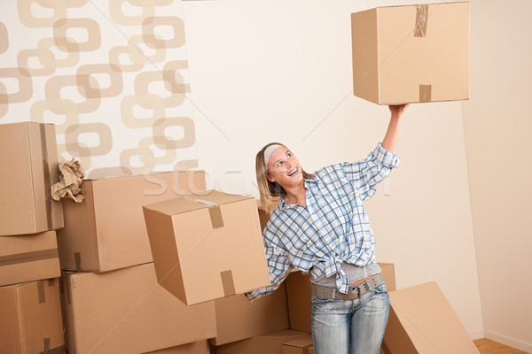 Moving house: Woman holding big carton box Stock photo © CandyboxPhoto