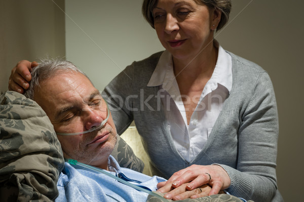 Caring nurse with sleeping senior male patient Stock photo © CandyboxPhoto