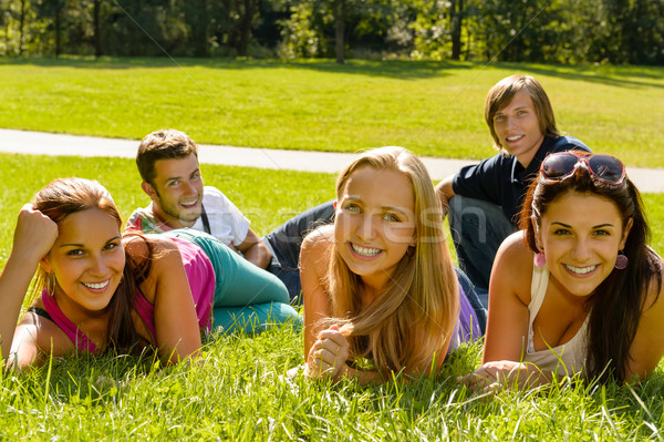 Students laying on grass in park campus Stock photo © CandyboxPhoto