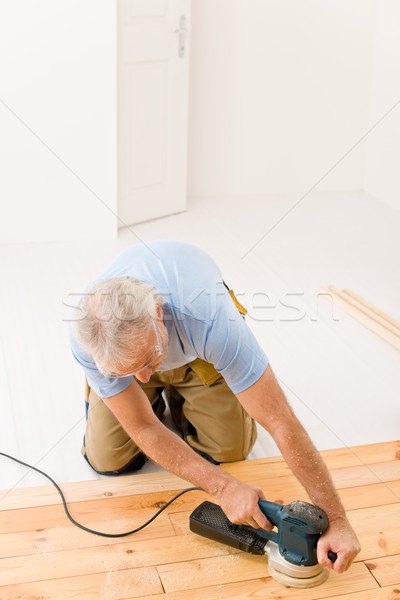 Home improvement - handyman sanding wooden floor  Stock photo © CandyboxPhoto