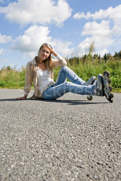 Inline skates young woman sitting asphalt road Stock photo © CandyboxPhoto