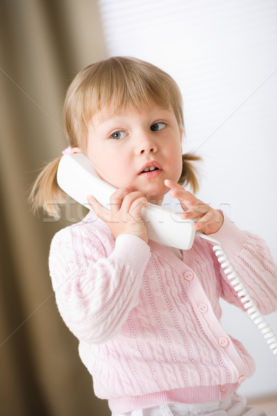 Little girl holding telephone receiver calling Stock photo © CandyboxPhoto