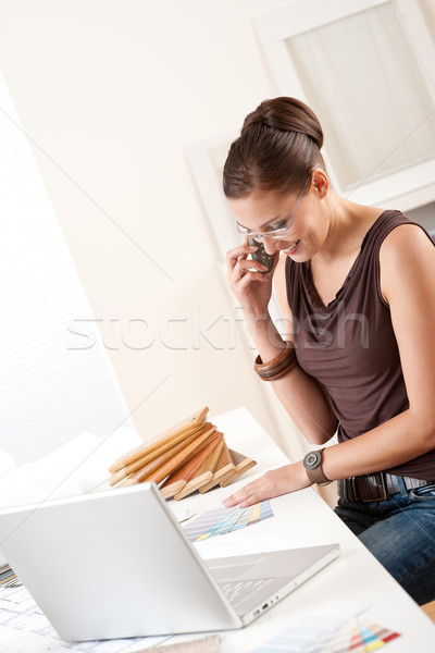 Young female designer on the phone at office Stock photo © CandyboxPhoto