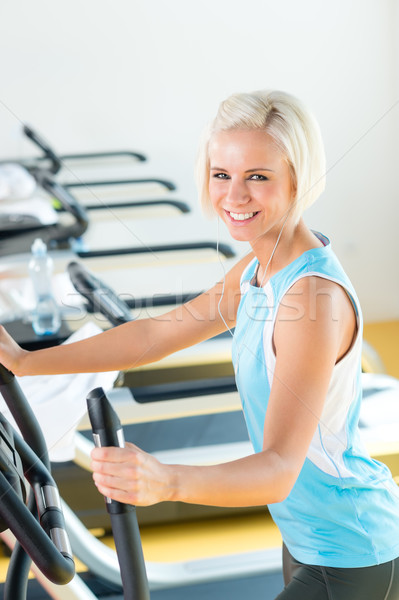Fitness young woman on elliptical cross trainer Stock photo © CandyboxPhoto