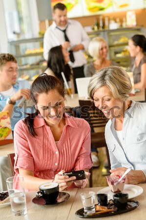 Waiter giving woman cake plate at cafe Stock photo © CandyboxPhoto