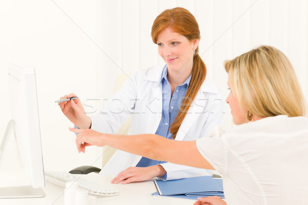 Stock photo: Female doctor consultation patient point computer