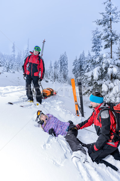 Ski patrol helping woman with broken leg Stock photo © CandyboxPhoto